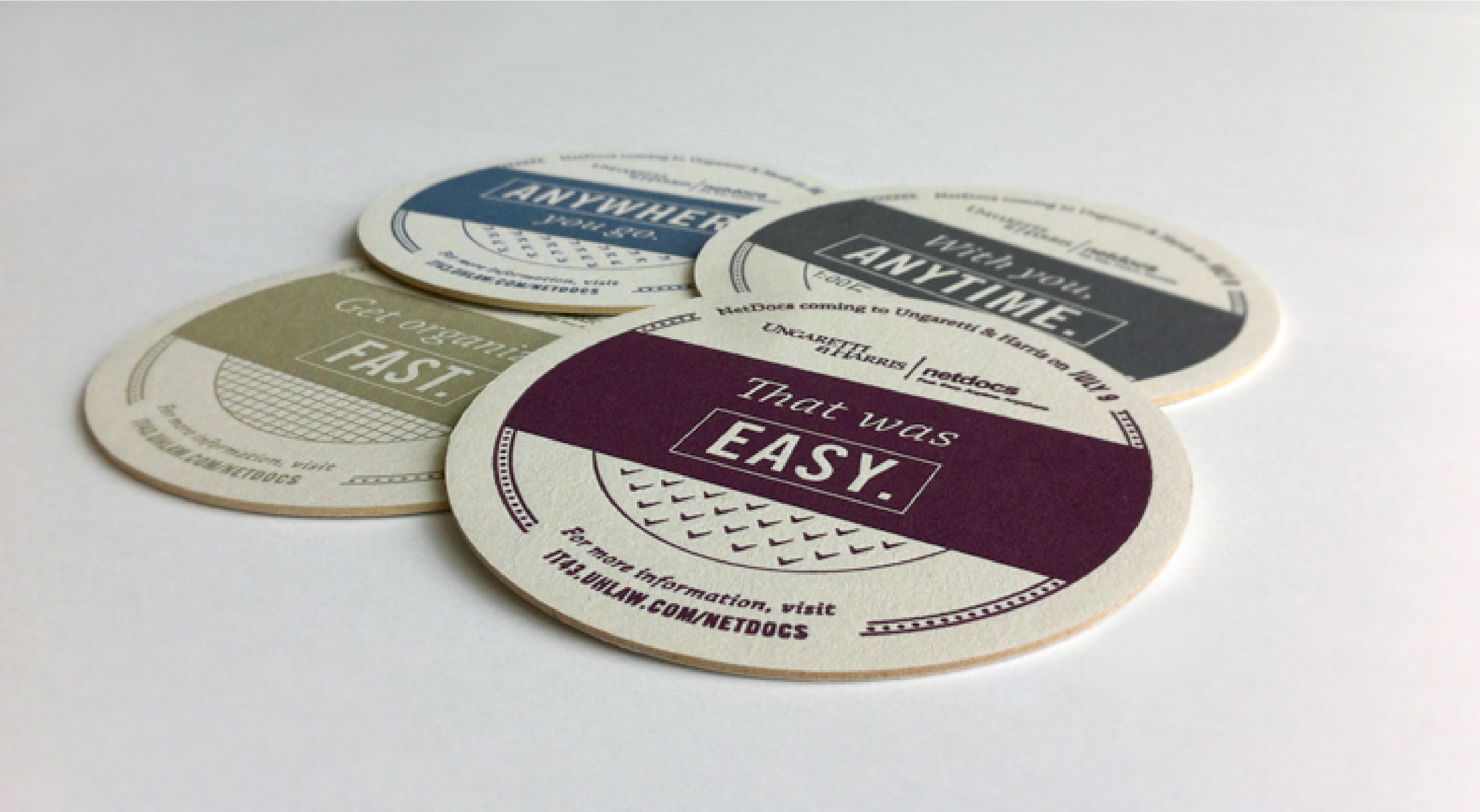 IT43 coasters that read "That was easy"