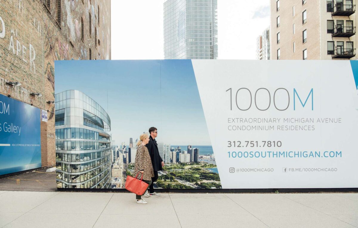 Close up of outdoor advertising barricade designed for luxury real estate brand 1000M