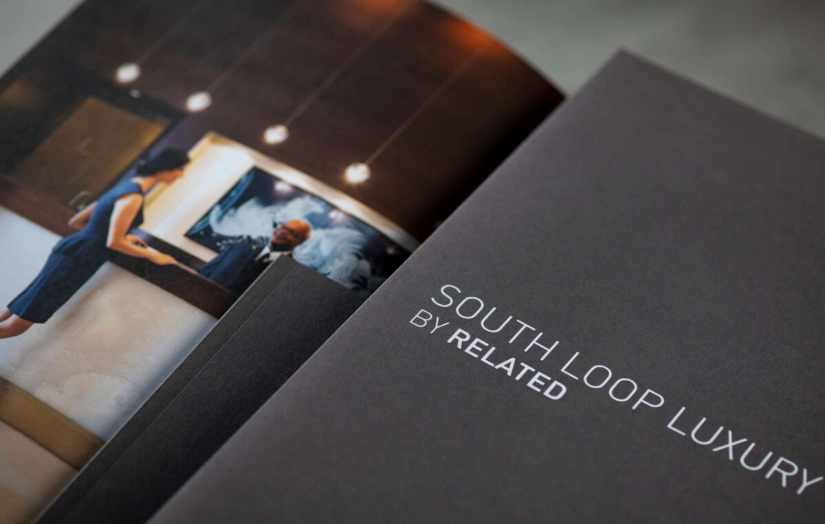 Real estate branding print collateral kit designed for South Loop Luxury by Related