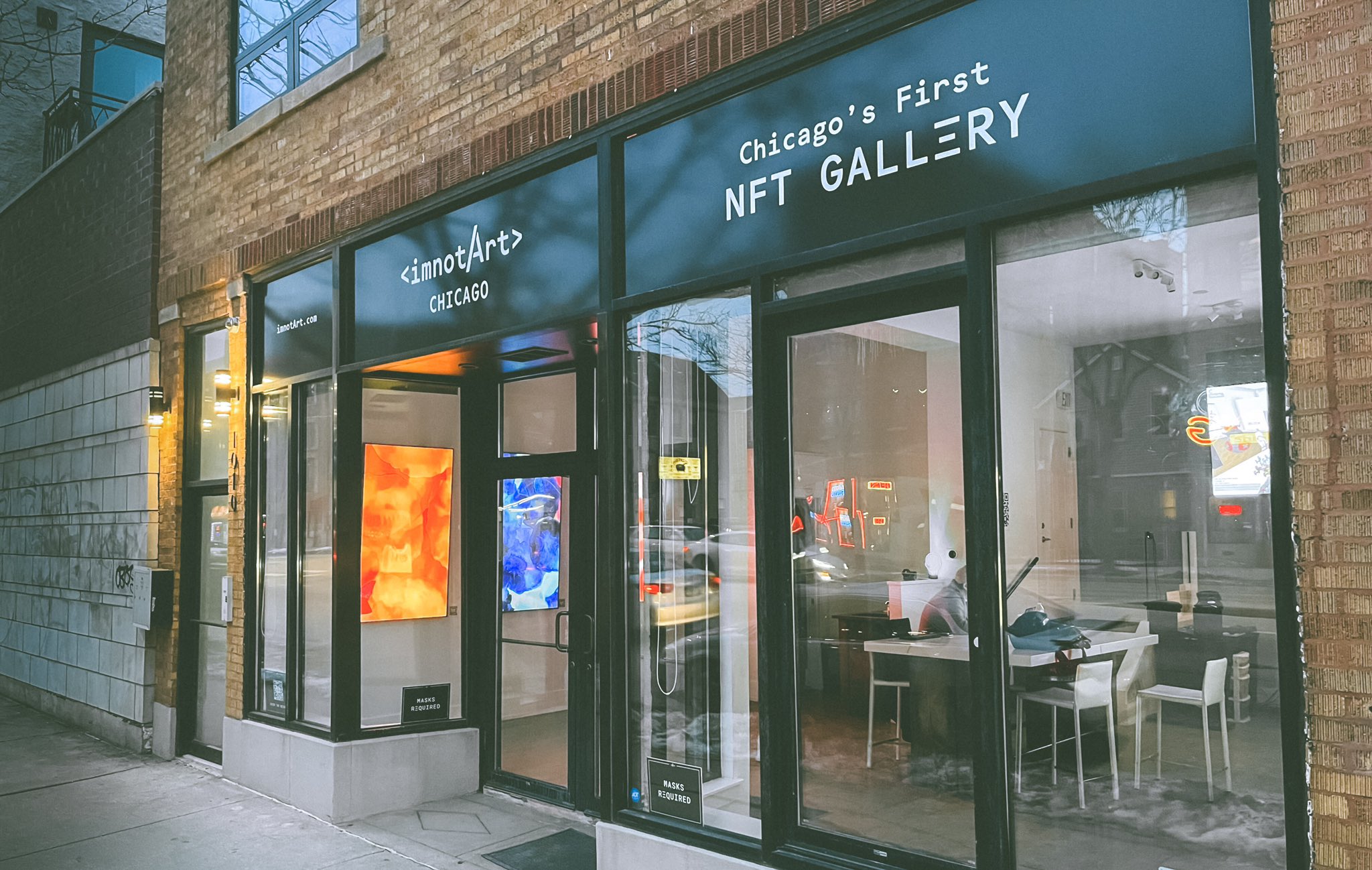 A storefront with signage that reads imnotArt Chicago's first NFT gallery